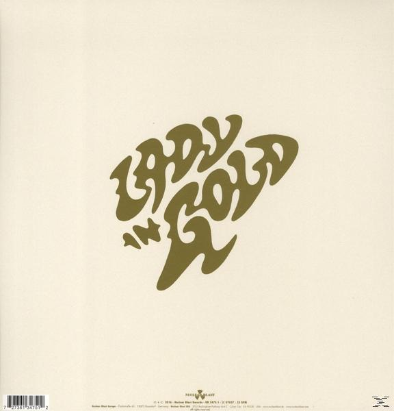 Album borító a 'Lady in Gold' szavakkal stilizált betűtípussal, krémszínű háttérrel.