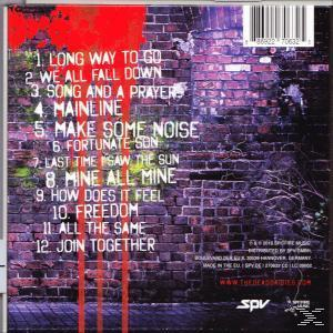 CD-Rückseite mit Titelliste, 'The Dead Daisies', mit Backsteinmauerhintergrund und roten Akzenten.