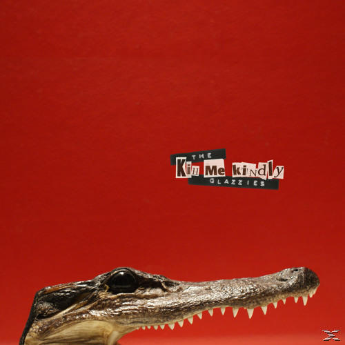 Ein Alligatorkopf mit Zähnen auf rotem Hintergrund. Text 'Kiss Me Kindly Glazzies' wird gezeigt.