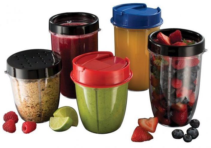 Five smoothie cups with lids. They contain different fruits and vegetables, with various colors.