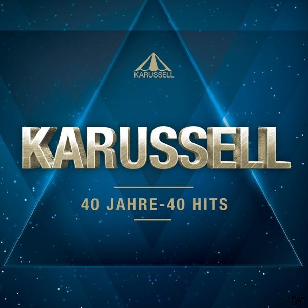 Albumcover mit dem Text 'KARUSSELL' und einem blauen Hintergrund mit goldenen Dreiecken.