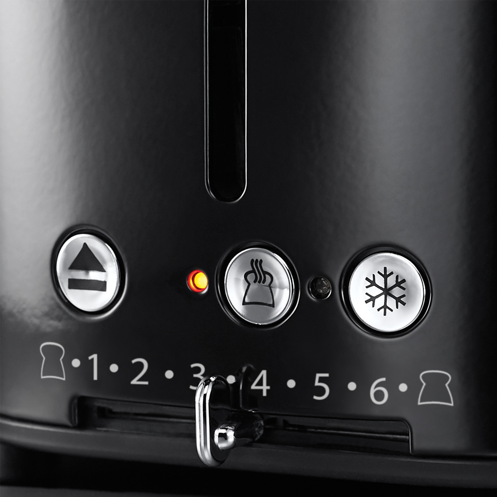 A close-up of a black toaster with control buttons and settings for toasting.