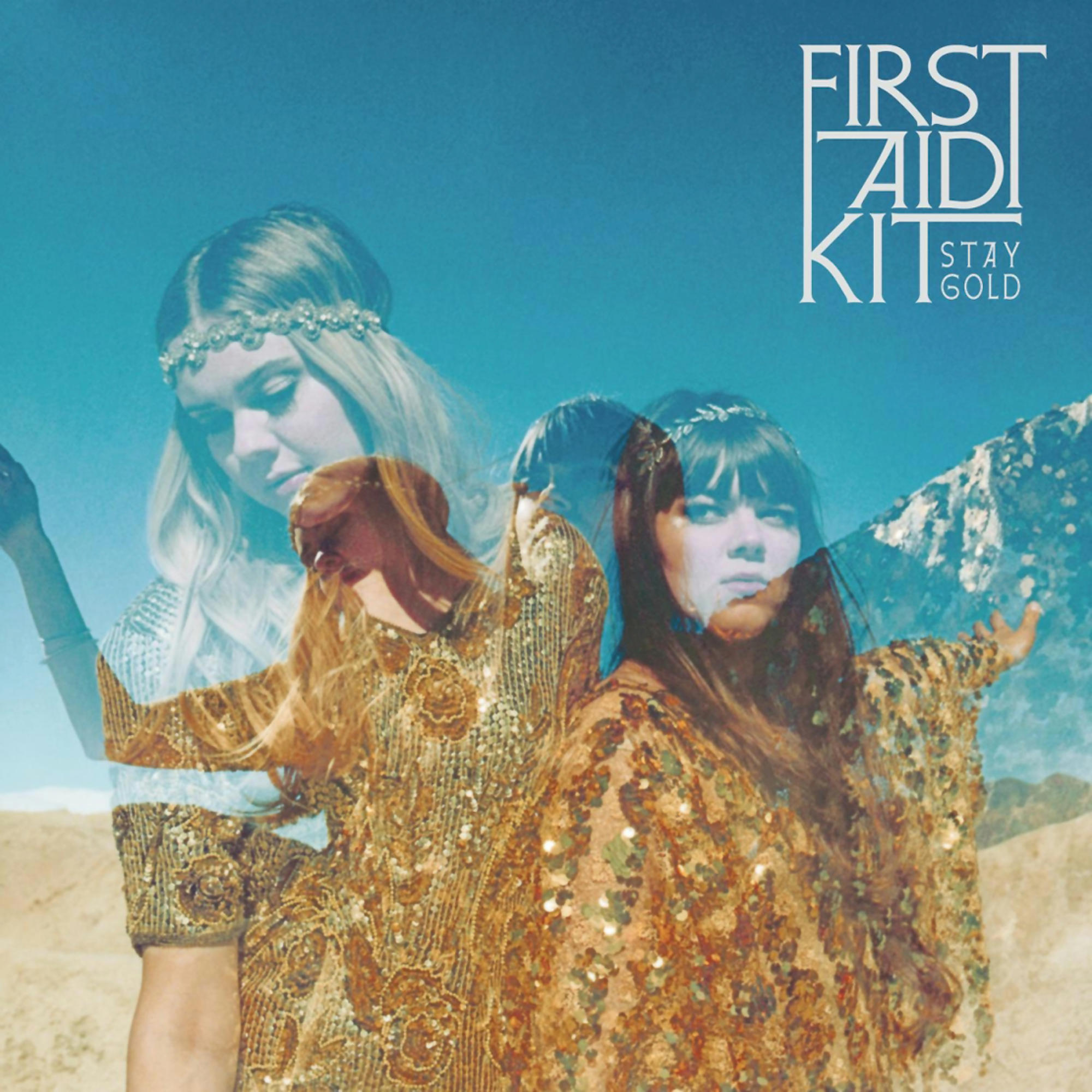 Albumcover für First Aid Kit - Stay Gold. Frauen in goldenen Kleidern überlagert auf einer Landschaft.