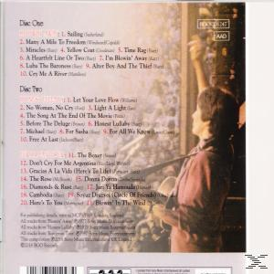 CD-Cover mit Titelliste und einer Frau im Profil. Der Hintergrund zeigt ein verschwommenes Stadtbild.