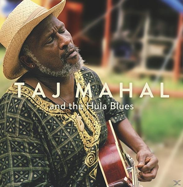 Taj Mahal Albumcover. Mann mit Hut und Gitarre in bunter Umgebung.