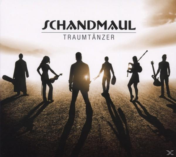 Silhouetten von Bandmitgliedern vor Sonnenuntergang. Text: Schandmaul, Traumtänzer.