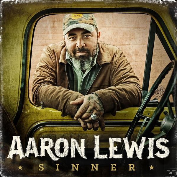 Aaron Lewis in einem gelben Truck, blickt in die Kamera, trägt eine Mütze. Albumcover.