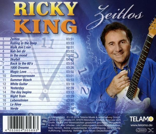 Rückseite einer CD-Hülle. Ein Mann hält eine Gitarre und lächelt. Titelliste und Albumtitel sind sichtbar.