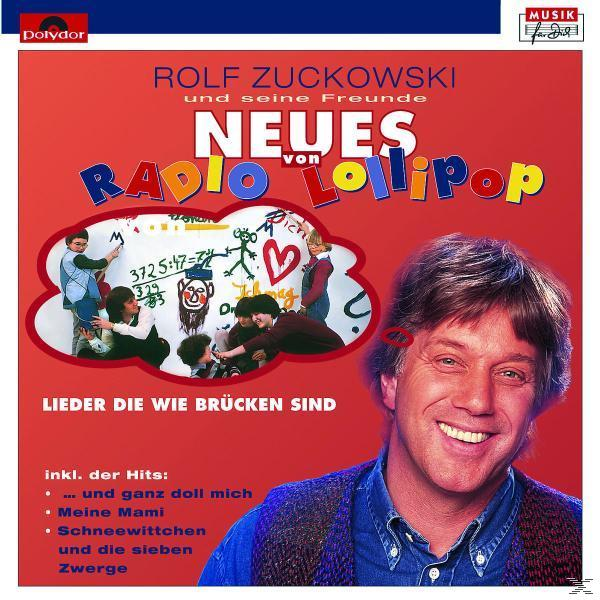 Albumcover mit einem lächelnden Mann und Cartoon-Grafiken.