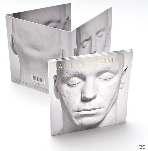 Albumhoes, wit beeldhouwwerk van een gezicht, meerdere aanzichten, titel 'Made in Germany' in goud.