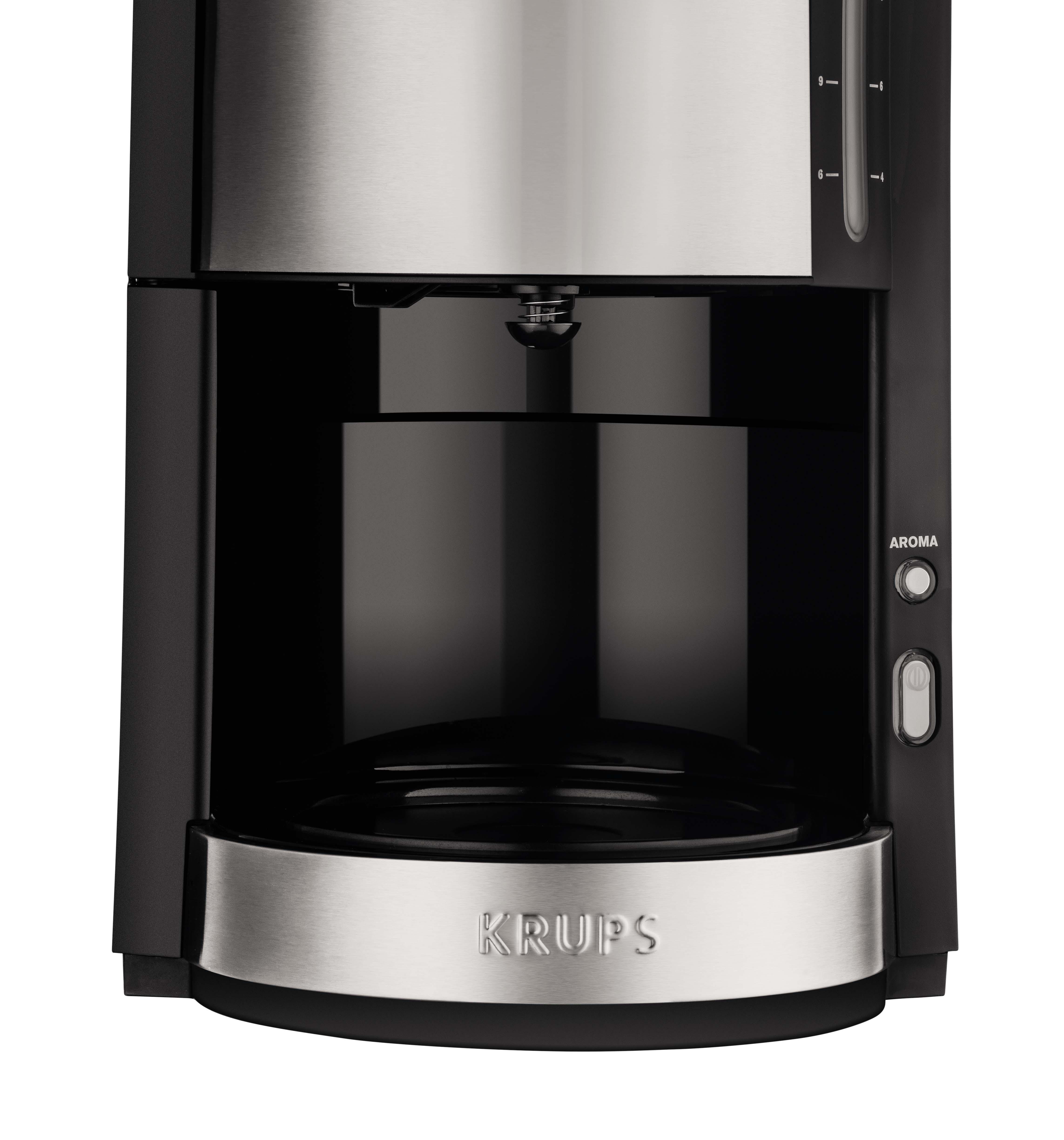 Black and silver coffee maker. It has a Krups logo and an aroma button. White background.