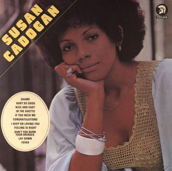 Albumcover von Susan Cadogan. Sie schaut in die Kamera und hat eine Hand im Gesicht, trägt ein Kleid.