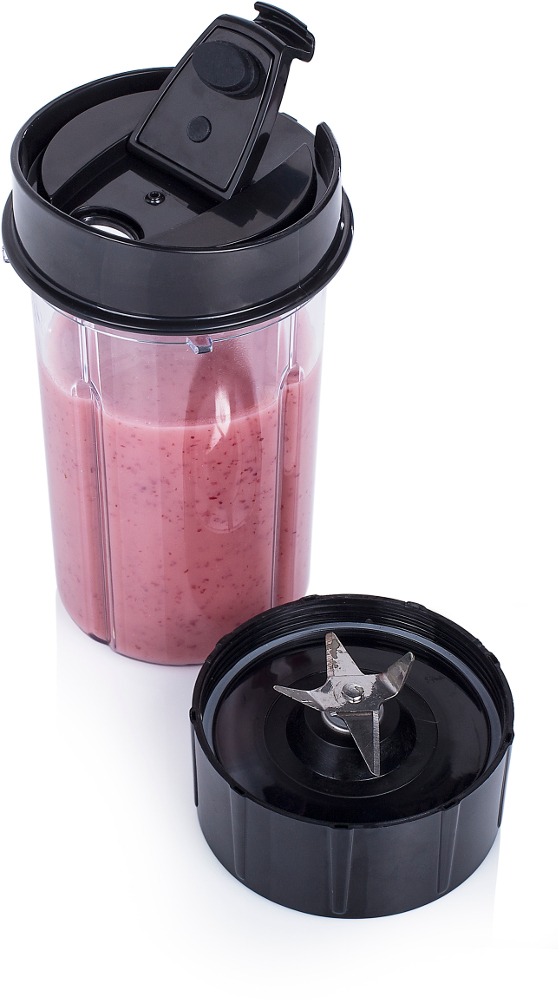 A blender cup with a pink smoothie, with the blade and lid off to the side.