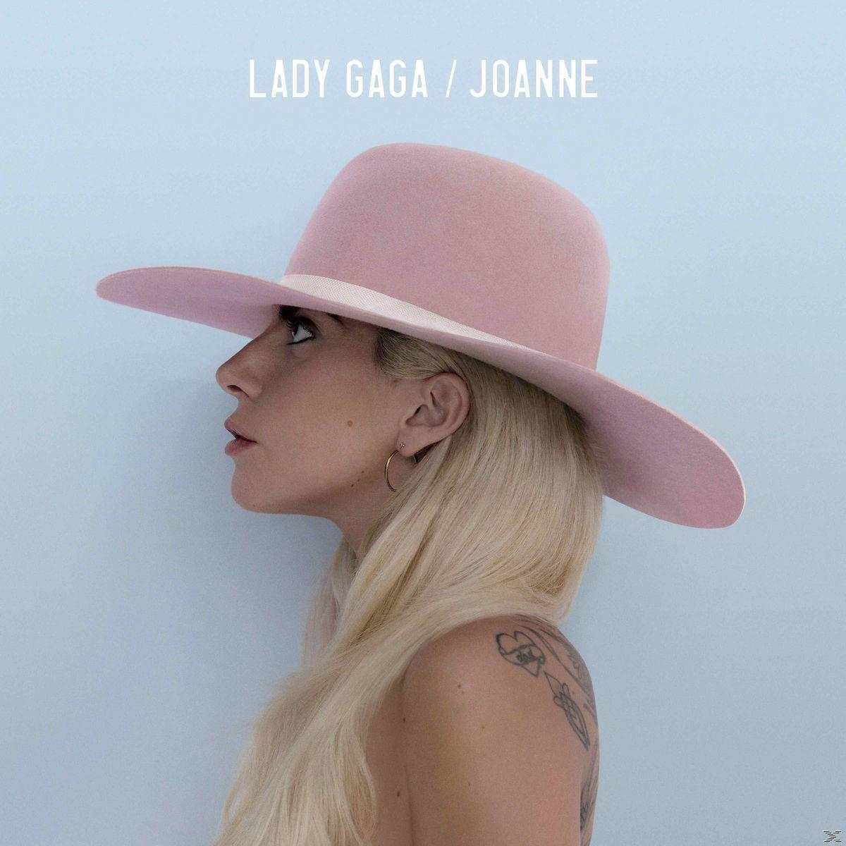Lady Gagas Albumcover: Profilansicht mit pinkfarbenem Hut und blonden Haaren vor blauem Hintergrund.