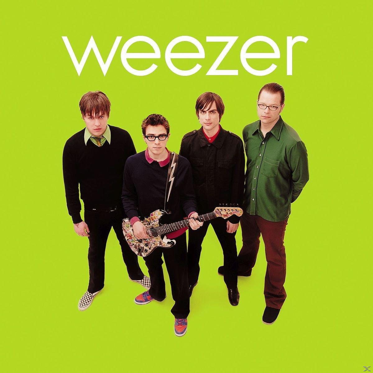 Weezer albumhoes met vier bandleden op een felgroene achtergrond.
