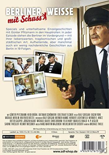 Rückseite einer DVD-Hülle mit Bildern, Text und einem Mann im Anzug, der eine Waffe hält.