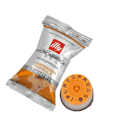 Kaffeekapselverpackung: weiß und orange mit Text und einer Kaffeekapsel daneben.