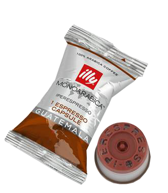 Illy Espresso Kapsel und eine lose Kapsel auf schwarzem Hintergrund.