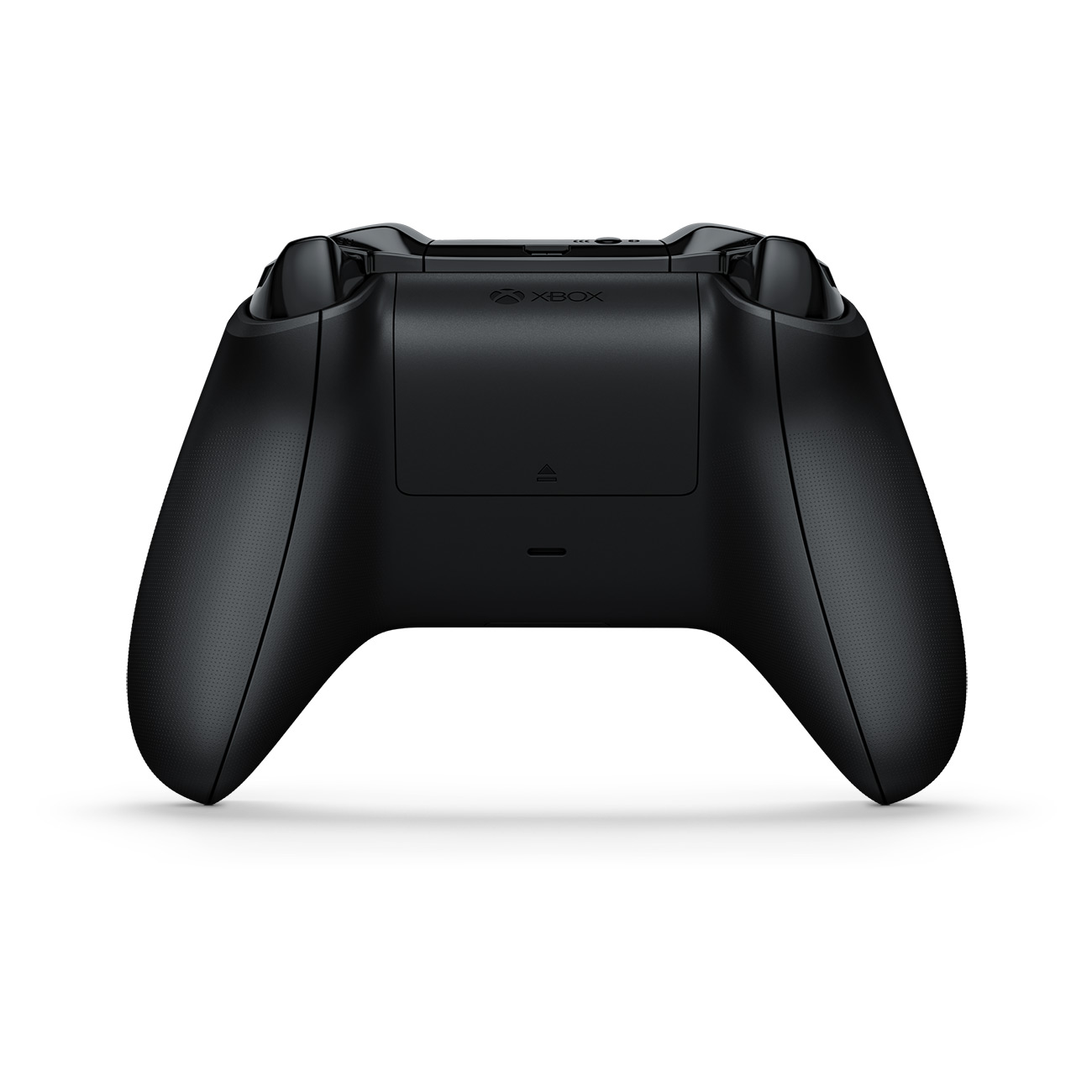 Zwarte Xbox-controller, achteraanzicht, toont het ontwerp van de achterkant en handgreep op een wit oppervlak.