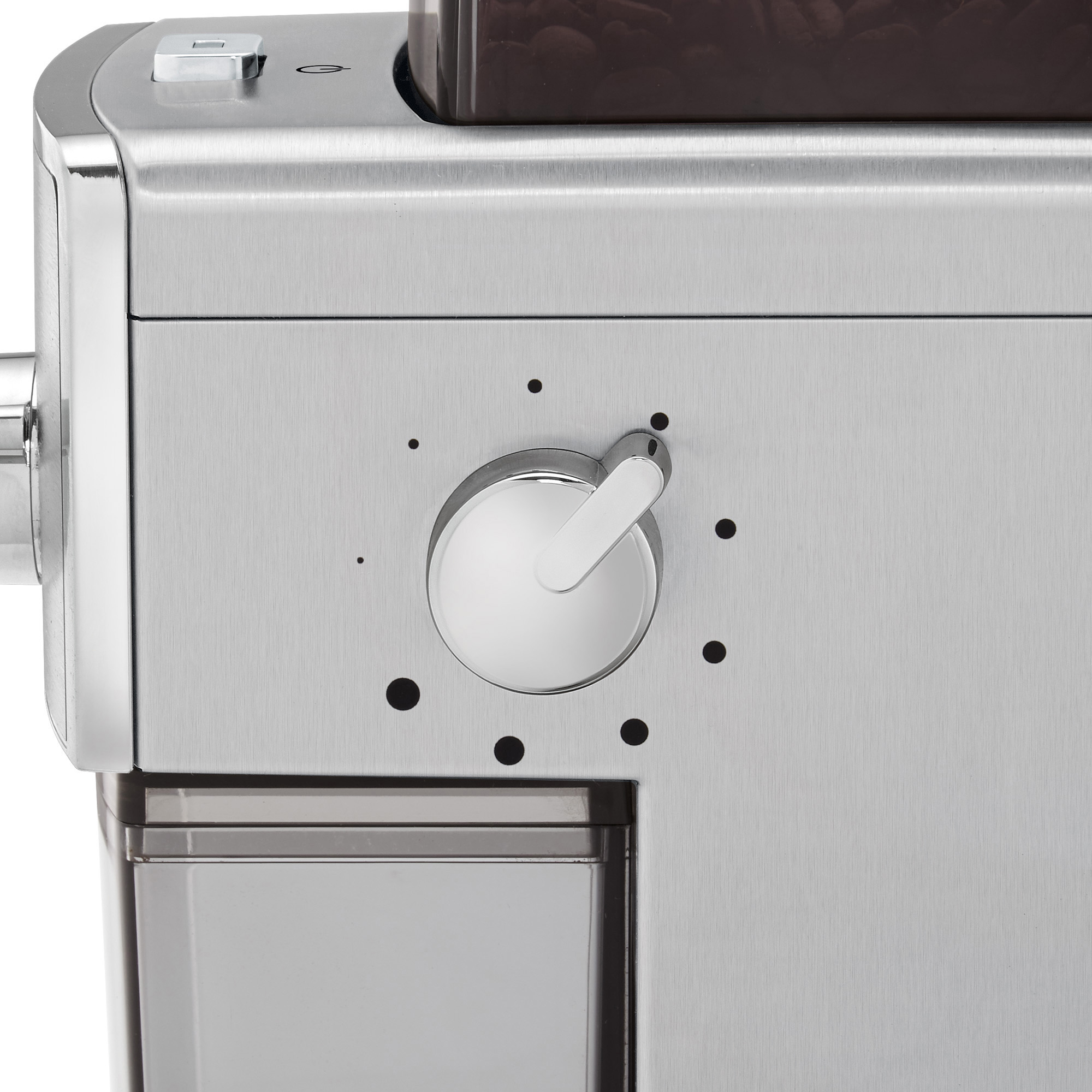 Nahaufnahme des Drehreglers einer Kaffeemaschine, der das Zifferblatt und die Umgebung zeigt.