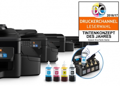 Drucker und Tintenflaschen. Ein Abzeichen sagt 'TINTENKONZEPT DES JAHRES'.