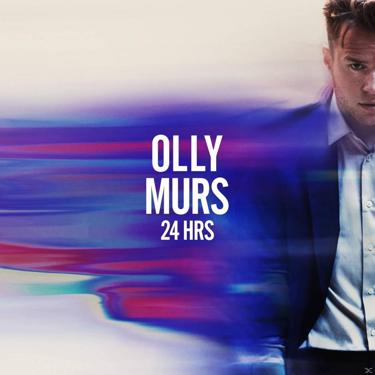 Olly Murs albumhoes. Man in pak, tekst 'Olly Murs 24 HRS'. Kleurrijke abstracte achtergrond met paars, blauw en wit.