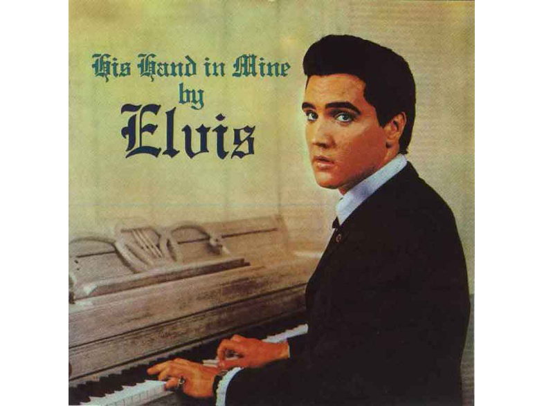 Elvis Presley egy lemezborítón, öltönyben, zongoránál ülve.