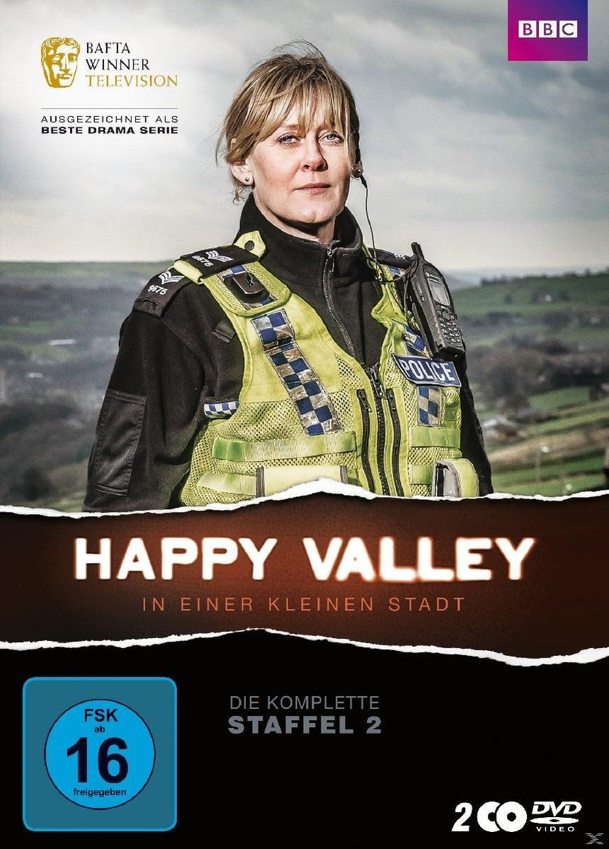 DVD-Cover von Happy Valley, eine Frau in Uniform und Polizeimarke, BBC-Logo.