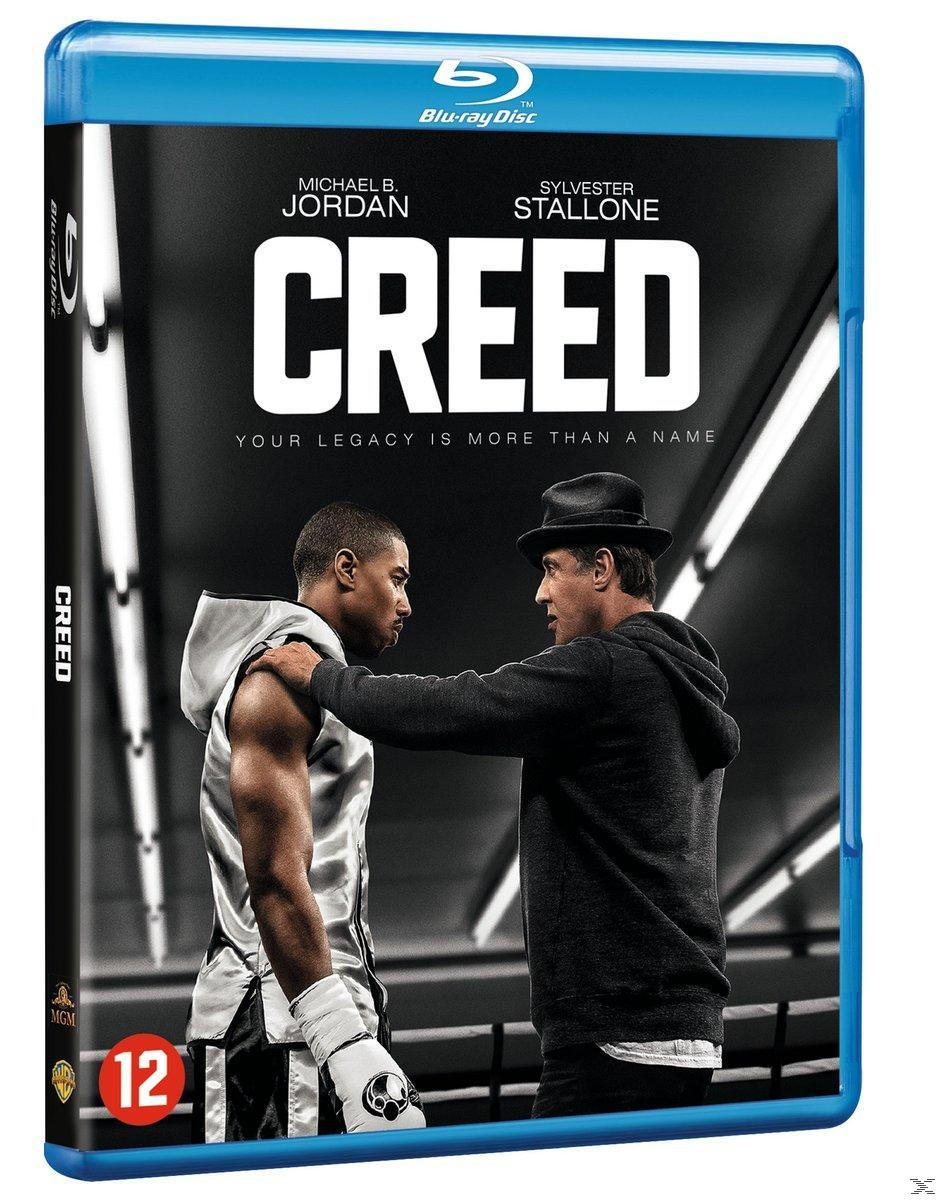 Couverture Blu-ray du film Creed. Montre deux hommes sur un ring de boxe, l'un en sweat à capuche.