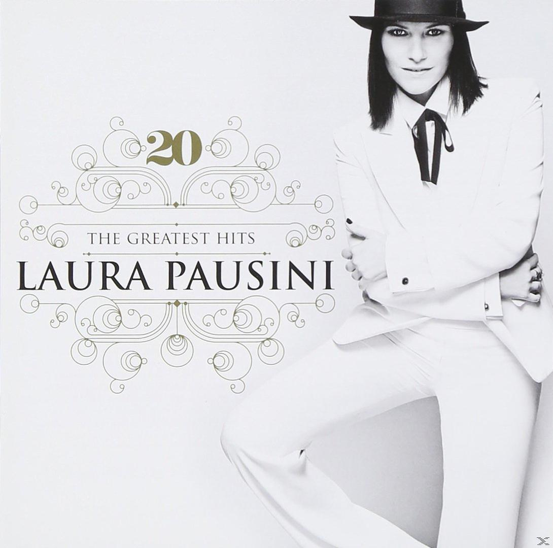 Albumhoes van Laura Pausini, in een wit pak en hoed. De achtergrond is licht met sierlijk gouden ontwerp.