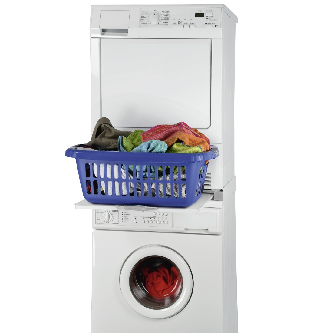 Stacked washer and dryer. A blue laundry basket sits on a shelf between them, full of colorful clothes.