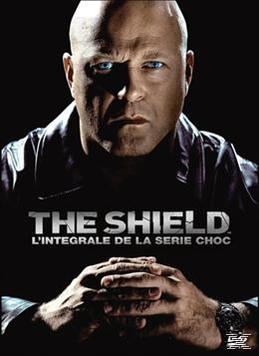 Filmposter met Bruce Willis die streng kijkt. De titel 'The Shield' staat erop.