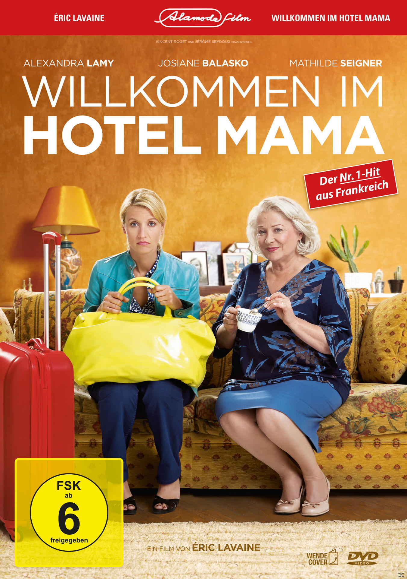 DVD-Cover für einen Film. Zwei Frauen sitzen auf einem Sofa. Gelbe Tasche links.