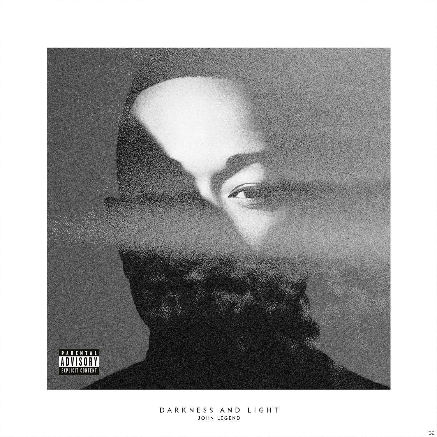 Albumcover: Gesicht von John Legend, Schwarzweiß. Titel: Darkness and Light. Hinweisaufkleber. Hintergrund ist ein verschwommenes Gesicht.