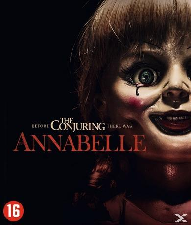 Affiche du film Annabelle, avec un visage de poupée au premier plan. Fond sombre avec texte.