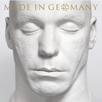 Moulage en plâtre blanc d'un visage d'homme, yeux fermés, avec l'inscription 'MADE IN GERMANY' en haut.