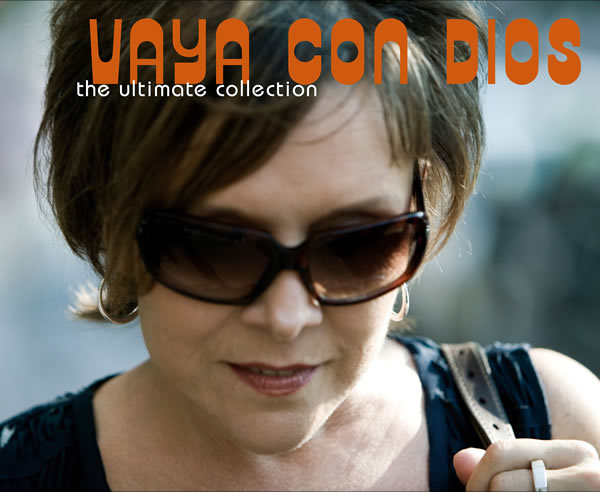 Pochette de l'album Vaya Con Dios. Une femme portant des lunettes de soleil. Texte orange en haut.