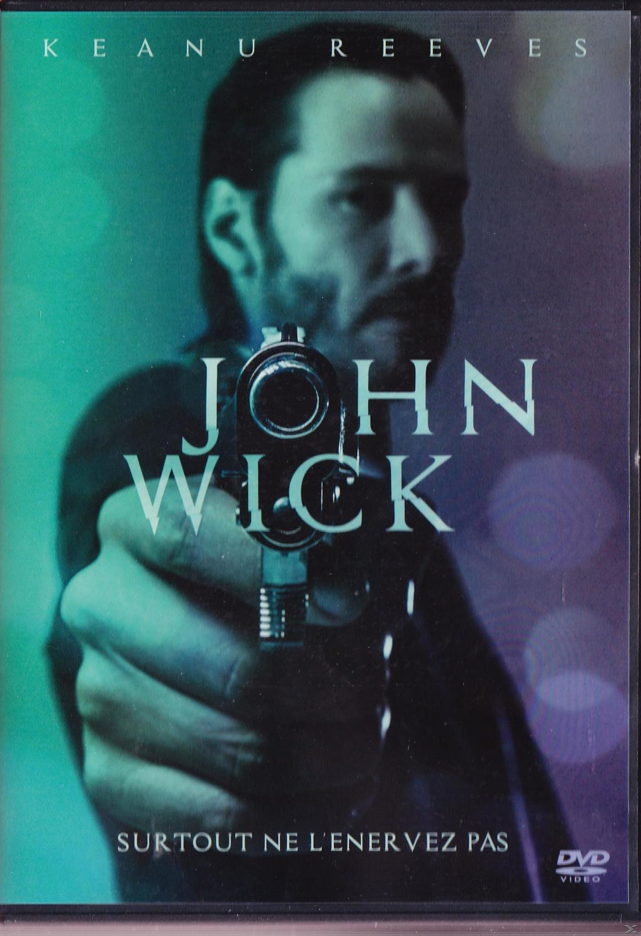 Jaquette du DVD John Wick avec Keanu Reeves tenant une arme.