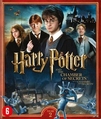 Couverture de DVD avec quatre personnages. Le titre est doré et il y a deux créatures.
