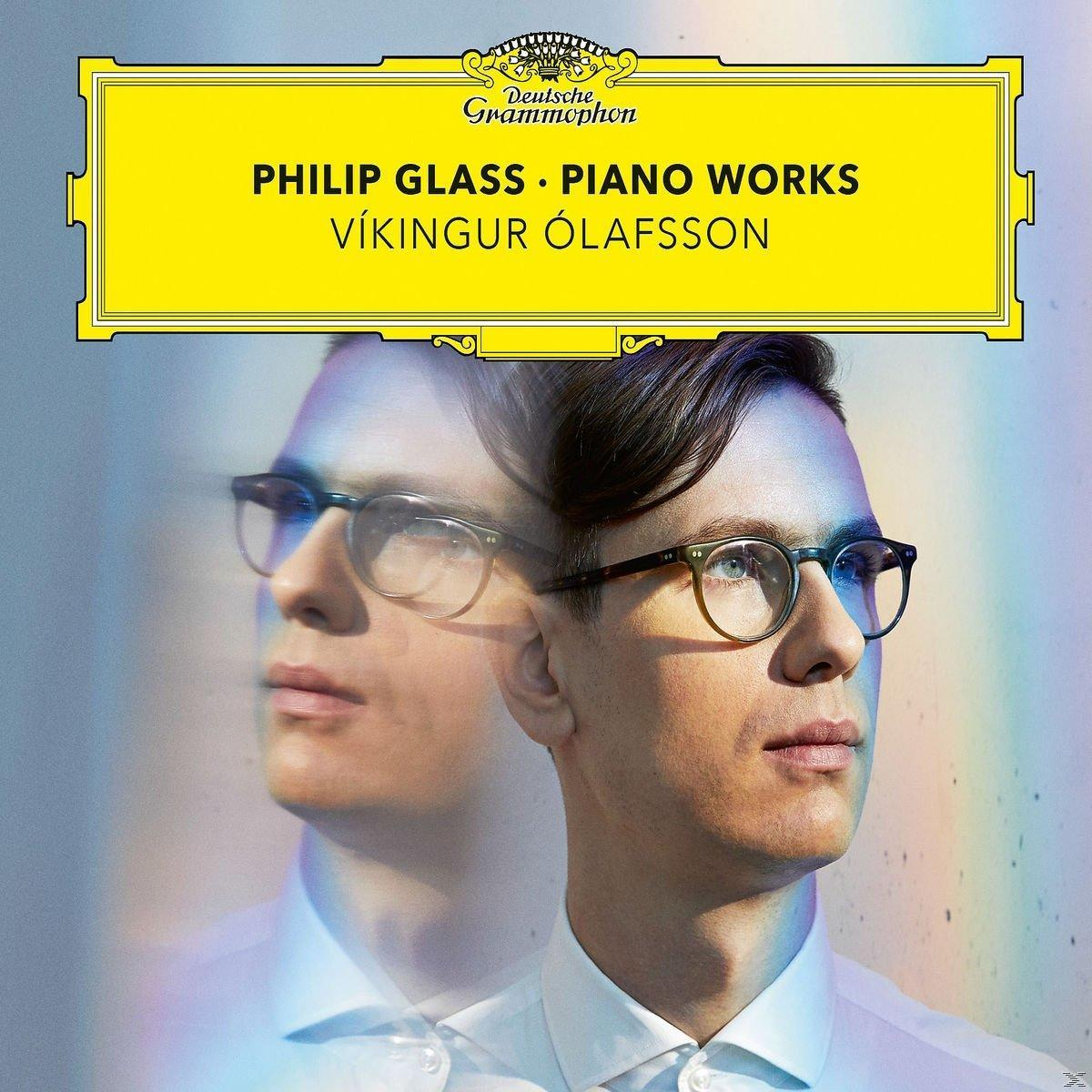 Albumcover: Mann mit Brille. Text sagt 'Philip Glass - Piano Works'. Gelber Hintergrund.