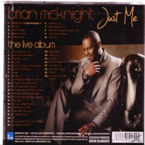 Brian McKnight Albumcover mit einem Mann im Anzug, der in einem Stuhl sitzt.