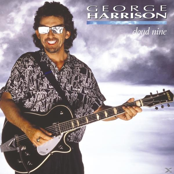 George Harrison sur la couverture de l'album. Il tient une guitare, portant des lunettes de soleil.