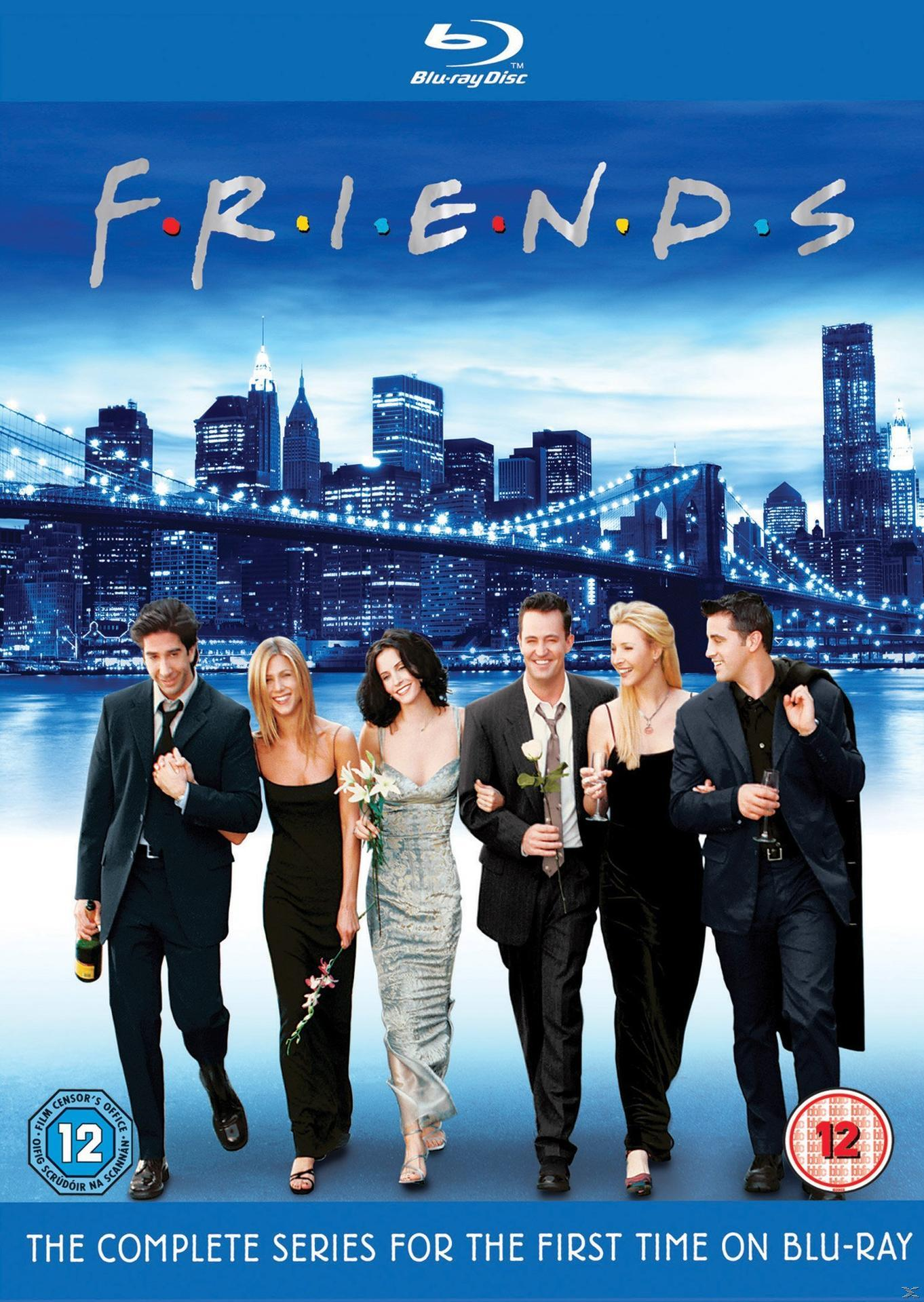 Blu-ray-hoes van 'Friends' met de cast voor een stadsgezicht en een brug.