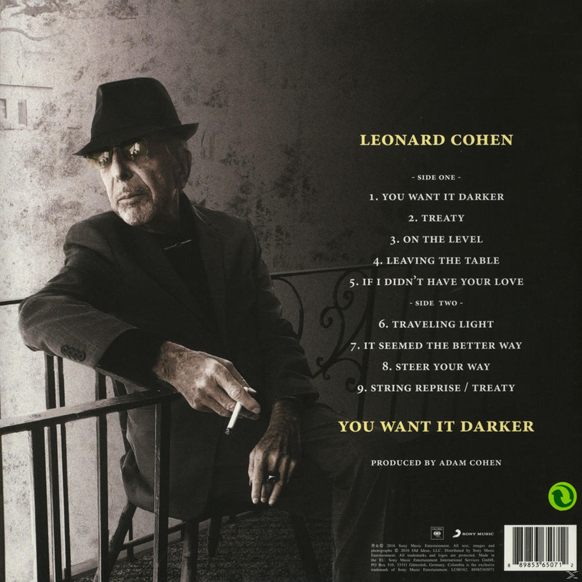 Albumcover von Leonard Cohen, sitzend, rauchend, mit Titelliste auf dunklem Hintergrund.