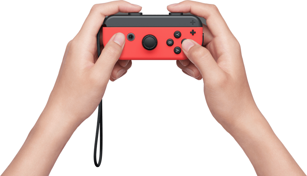 Mains tenant une manette Nintendo Switch rouge. Les boutons A, B, X et Y sont visibles.