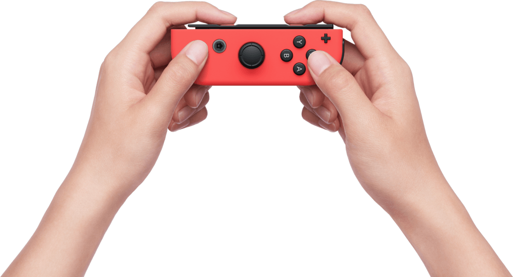 Deux mains tenant une manette Nintendo Switch rouge. Des boutons noirs et un joystick analogique noir sont visibles.