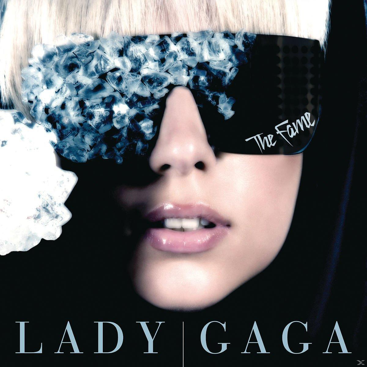 Lady Gaga Albumcover. Nahaufnahme ihres Gesichts mit Sonnenbrille und Text darunter.