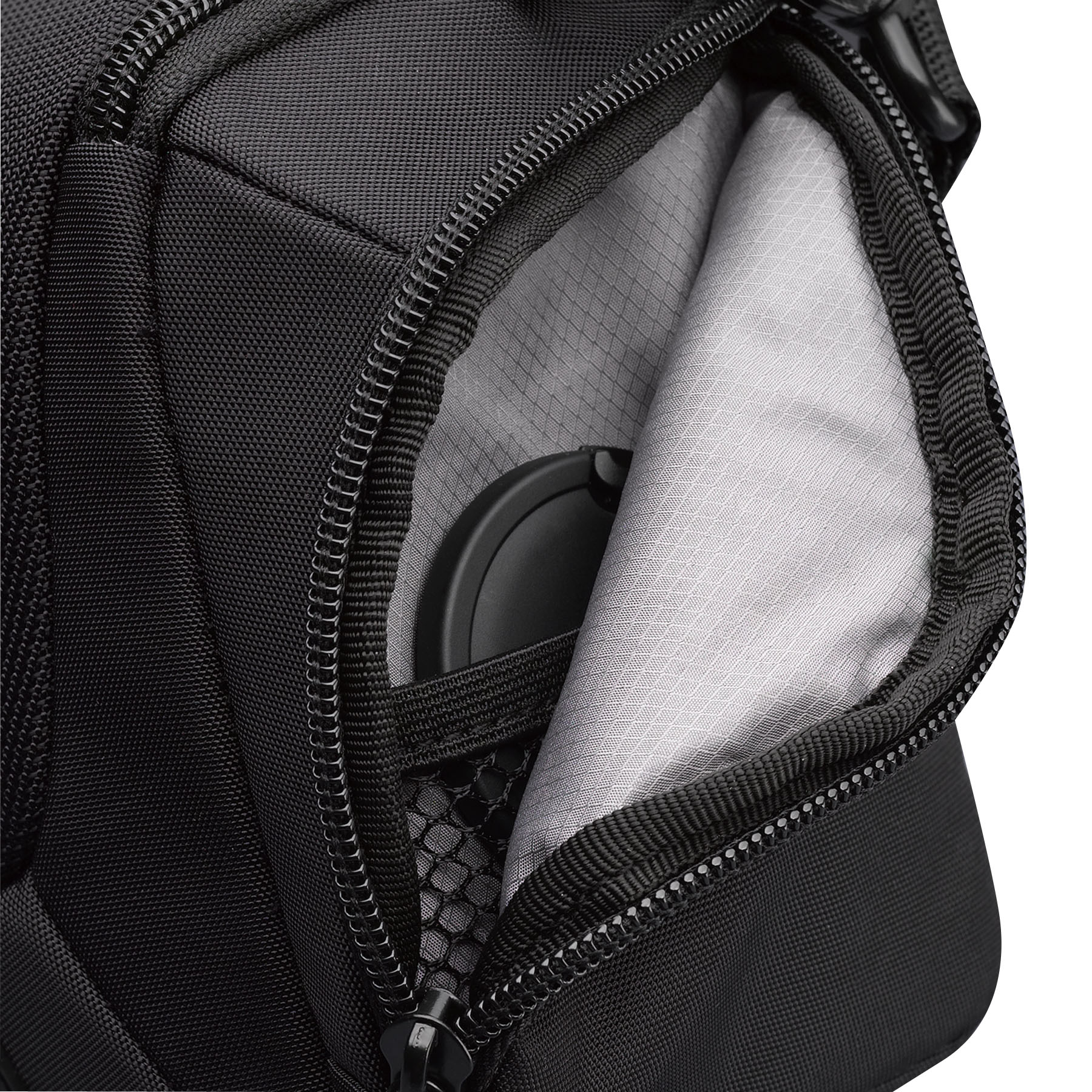 Black camera bag, open, revealing a lens and white lining. Zipper and mesh pocket visible.