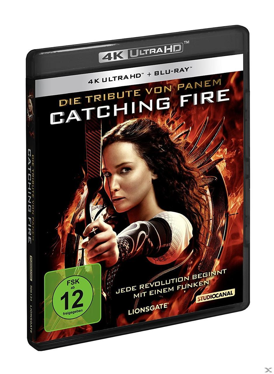 Filmcover von 'The Hunger Games: Catching Fire'. Jennifer Lawrence mit Bogen, Flammen im Hintergrund.