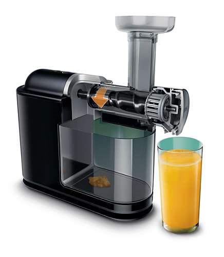 A black juicer with a glass of orange juice on the right, and some pulp.